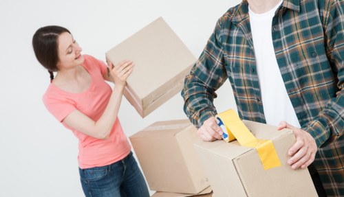 Family home relocation support in Woolwich with boxes and furniture