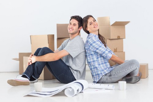 Organised flat removals in Woolwich with furniture and boxes ready for transport