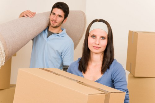 Man and van team handling household items during a scheduled move