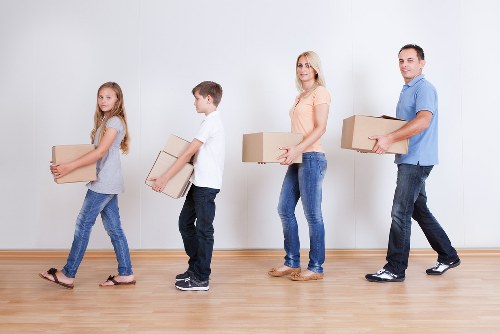 Professional movers handling boxes in Woolwich