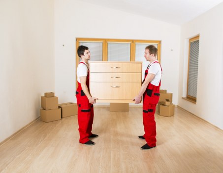 Office equipment and packed boxes ready for commercial moves in Woolwich